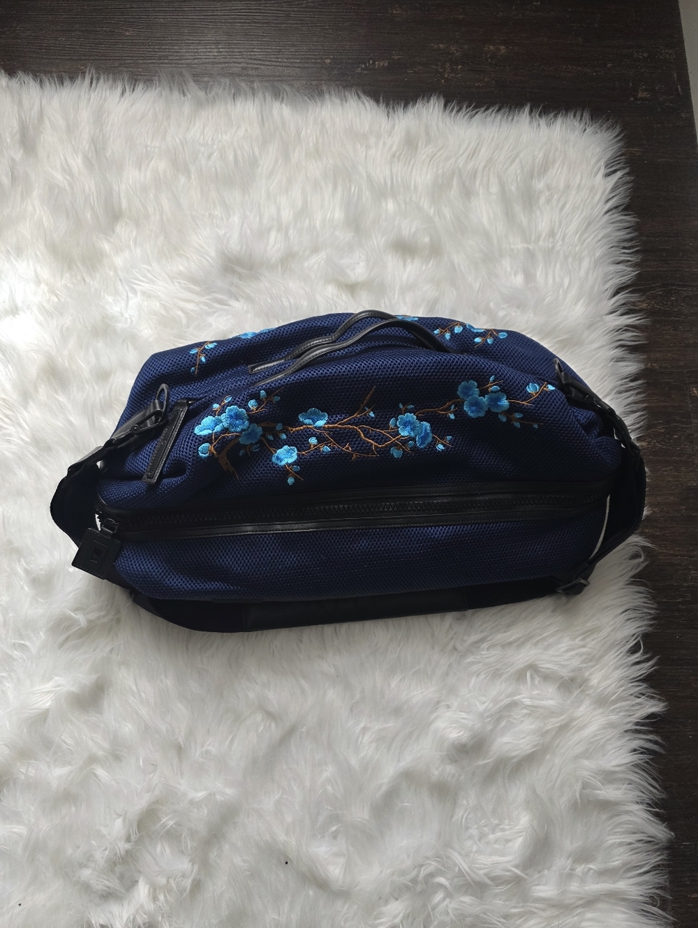 caraa Navy Blue Crossbody Travel Bag with Turquoise Floral Embroidery
